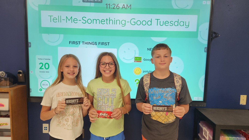 Students pose with prizes earned for winning the classroom keyboarding competition