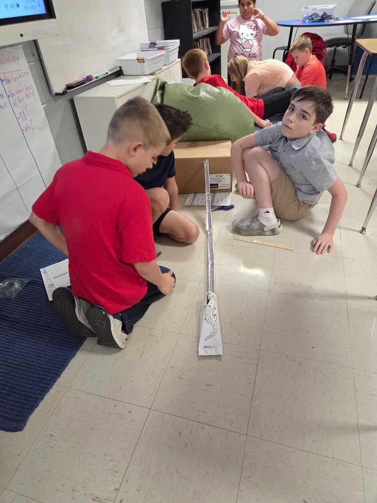Mrs. Wilson’s 4th grade class turned the classroom into a mini theme park today as students designed and tested their own roller coaster tracks!     The challenge: demonstrate the transfer of energy by releasing a marble at different heights to see how it impacts where the “bumper car” lands.  Warriors discover how energy works in the real world.  ❤️🤍