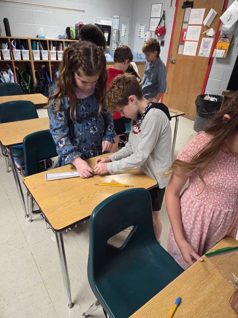 Mrs. Wilson’s 4th grade class turned the classroom into a mini theme park today as students designed and tested their own roller coaster tracks!     The challenge: demonstrate the transfer of energy by releasing a marble at different heights to see how it impacts where the “bumper car” lands.  Warriors discover how energy works in the real world.  ❤️🤍