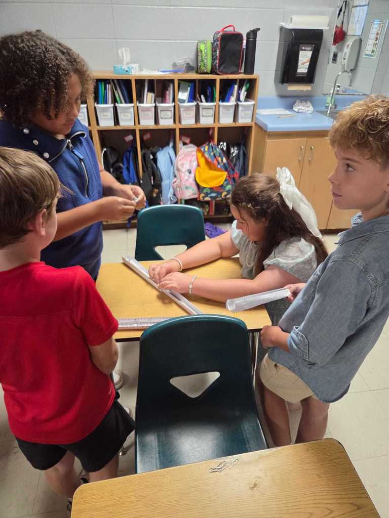 Mrs. Wilson’s 4th grade class turned the classroom into a mini theme park today as students designed and tested their own roller coaster tracks!     The challenge: demonstrate the transfer of energy by releasing a marble at different heights to see how it impacts where the “bumper car” lands.  Warriors discover how energy works in the real world.  ❤️🤍