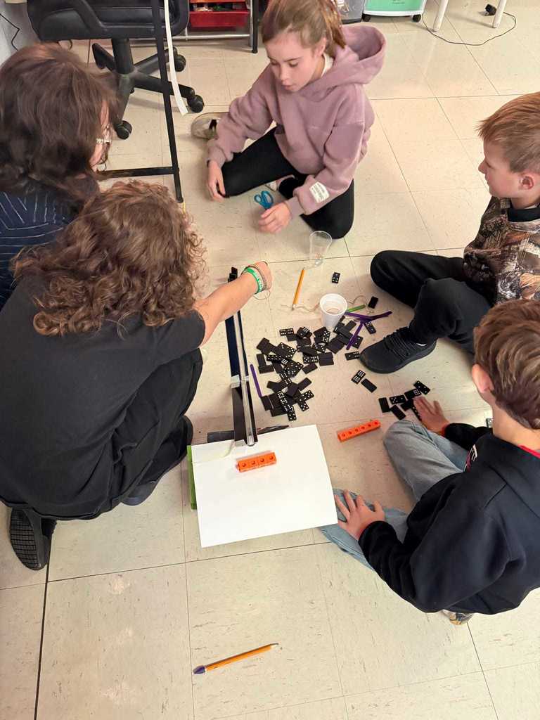 Ms. Cline’s 4th grade science students have been learning all about energy and energy transfer, and today they put their knowledge to the test!   Students worked in teams to design and build chain reaction models using materials from around the classroom. They explored how motion and energy move from one object to another — discovering real-world examples of cause and effect.  Great job, Warriors!  ❤️🤍