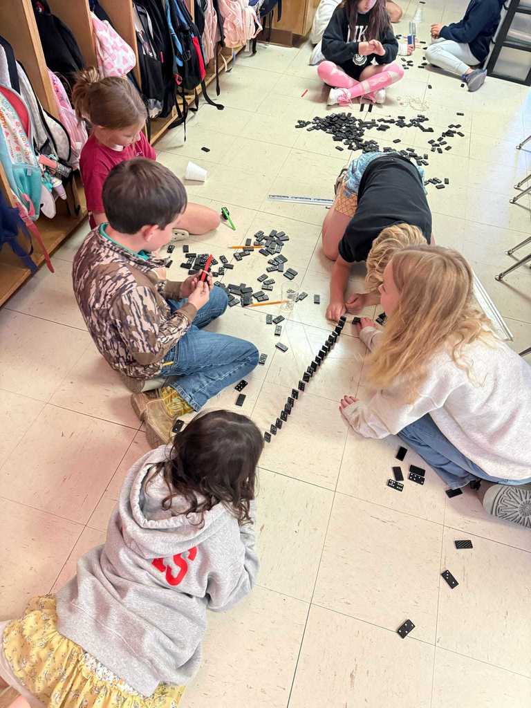 Ms. Cline’s 4th grade science students have been learning all about energy and energy transfer, and today they put their knowledge to the test!   Students worked in teams to design and build chain reaction models using materials from around the classroom. They explored how motion and energy move from one object to another — discovering real-world examples of cause and effect.  Great job, Warriors!  ❤️🤍
