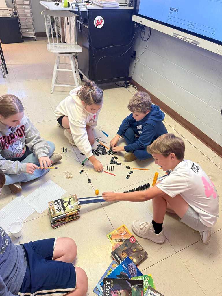 Ms. Cline’s 4th grade science students have been learning all about energy and energy transfer, and today they put their knowledge to the test!   Students worked in teams to design and build chain reaction models using materials from around the classroom. They explored how motion and energy move from one object to another — discovering real-world examples of cause and effect.  Great job, Warriors!  ❤️🤍