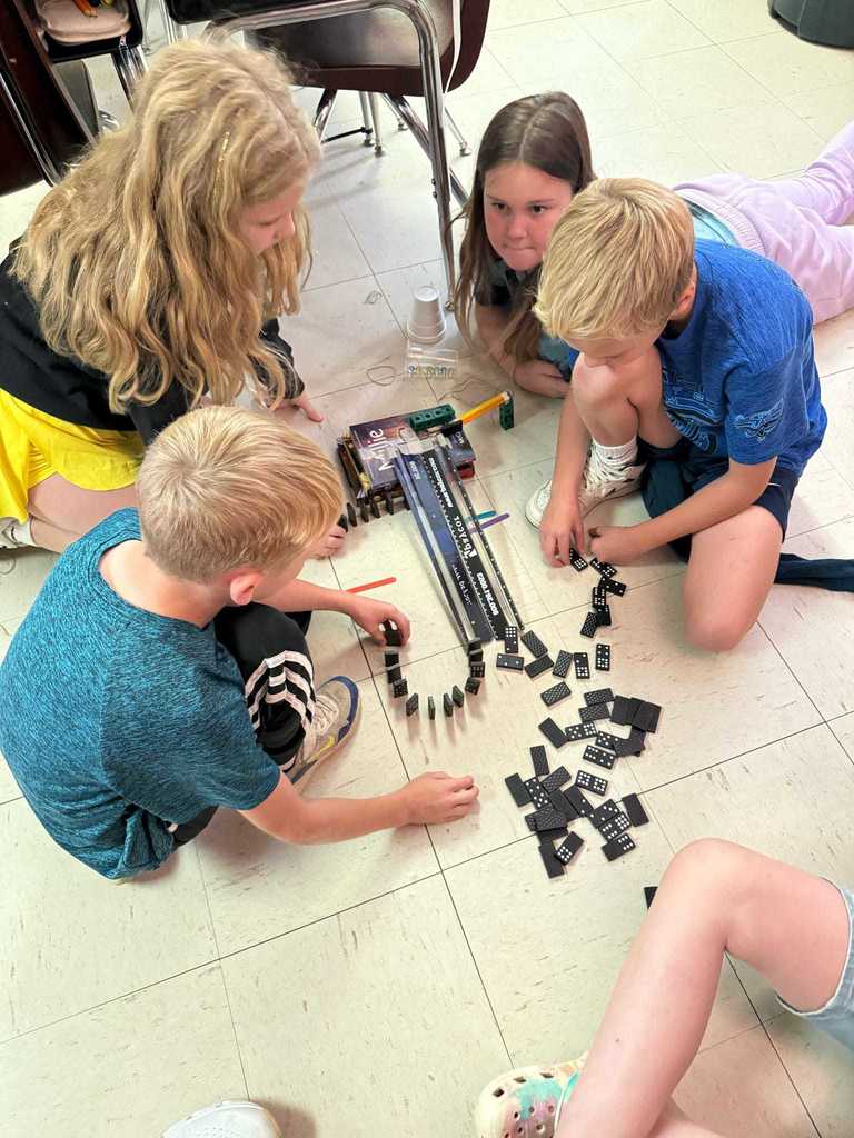 Ms. Cline’s 4th grade science students have been learning all about energy and energy transfer, and today they put their knowledge to the test!   Students worked in teams to design and build chain reaction models using materials from around the classroom. They explored how motion and energy move from one object to another — discovering real-world examples of cause and effect.  Great job, Warriors!  ❤️🤍