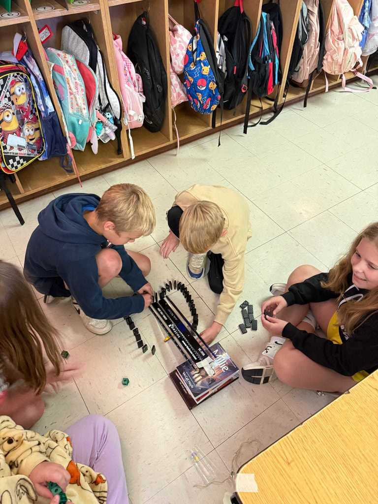 Ms. Cline’s 4th grade science students have been learning all about energy and energy transfer, and today they put their knowledge to the test!   Students worked in teams to design and build chain reaction models using materials from around the classroom. They explored how motion and energy move from one object to another — discovering real-world examples of cause and effect.  Great job, Warriors!  ❤️🤍