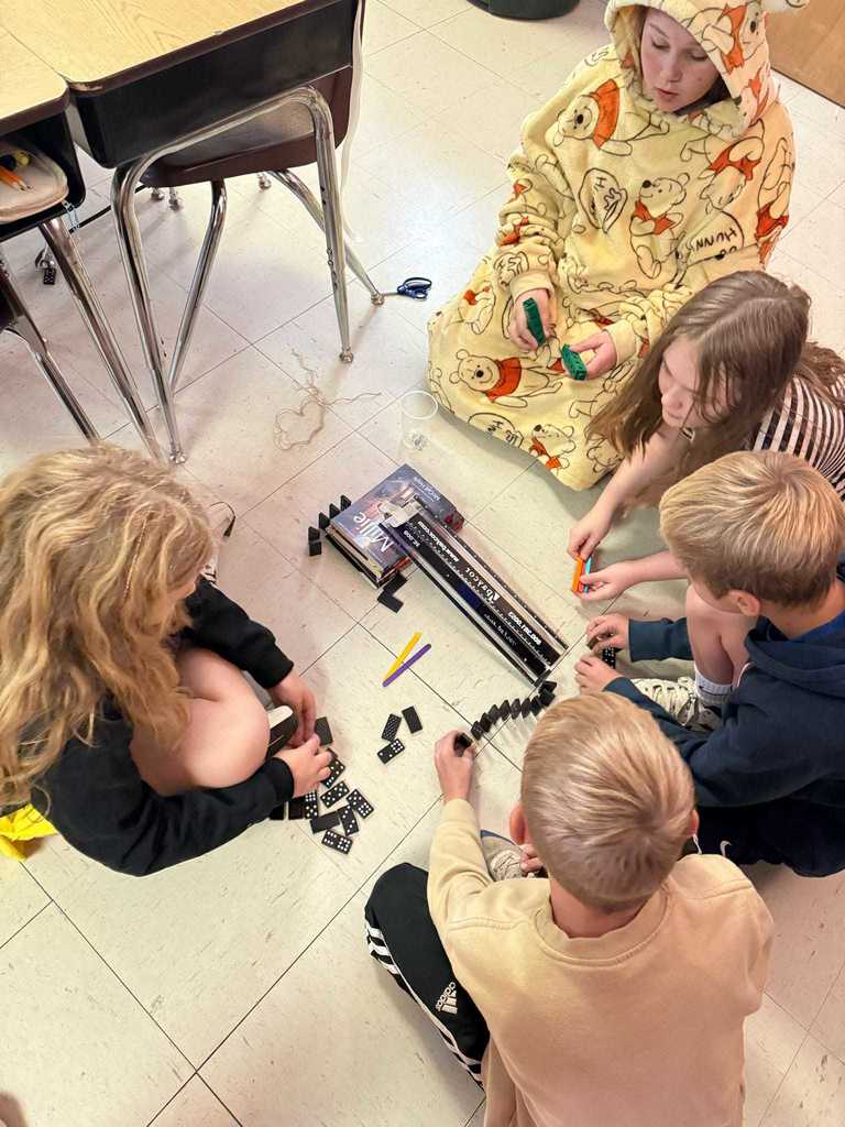 Ms. Cline’s 4th grade science students have been learning all about energy and energy transfer, and today they put their knowledge to the test!   Students worked in teams to design and build chain reaction models using materials from around the classroom. They explored how motion and energy move from one object to another — discovering real-world examples of cause and effect.  Great job, Warriors!  ❤️🤍