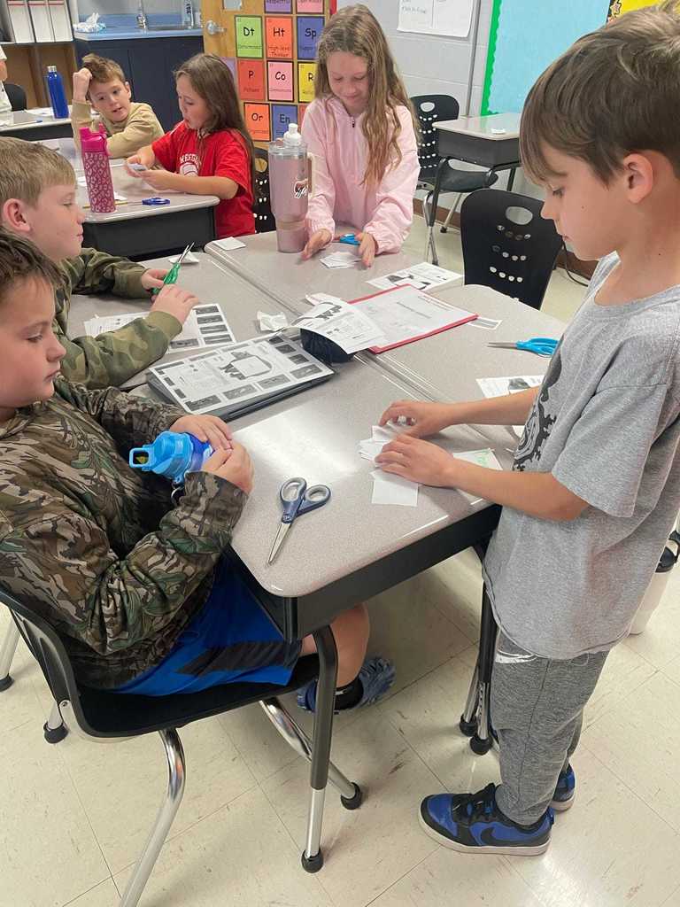 Ms. Russell’s 3rd graders had a “beary” good time today as they worked as brown and black bears.  They played a food-matching game to practice addition and energy concepts — proving that learning can be both fun and meaningful!   Ms. Russell shared that she was amazed by how much fun her students had while learning valuable math and science skills!