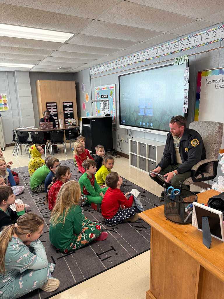 Ms. Copeland’s second grade class had a very special visitor today! Craighead County Deputy Aaron Chadwick stopped by to read The Polar Express for our Polar Express Day. The students were thrilled, and we are so grateful to Deputy Chadwick for making their morning magical!   After the story, the fun continued with a showing of The Polar Express, hot chocolate, popcorn, and—of course—pajama day at WES!  ❤️🤍🙌🙌