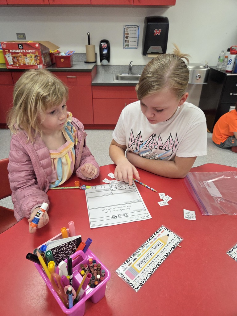 Mrs. Ally and Mrs. Wilson’s classes collaborated again today! Fourth grade students brought word problems to share with the kindergarten classes and helped guide them through solving using strategies such as tally marks, writing equations, and drawing pictures. After completing their work, students were treated to a fun science surprise! They dropped “mystery globs” into an unknown liquid and watched as they dissolved—revealing Mario coins and jewels inside. Great collaboration and hands-on learning happening at Westside! ❤️🤍