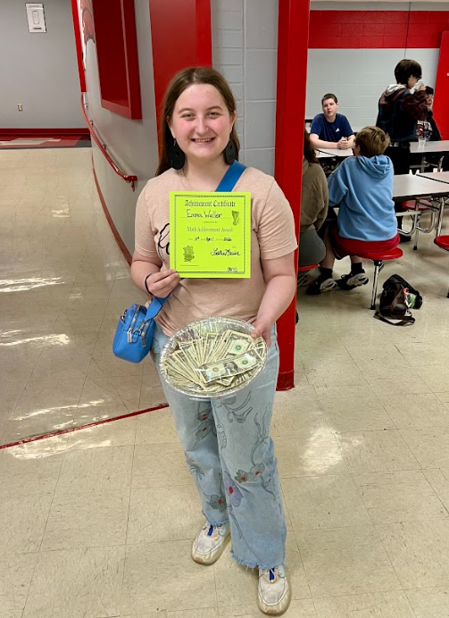 Each year for Pi Day, the Westside High School Math department hosts a competition among all our students to see who can recite the most digits of the irrational number Pi (3.1415…). It is announced in advance that the winner will receive $1 for each digit they can recite. The award this year goes to…..Ms. Emma Waller (Grade 10), who recited 171 digits of Pi. Congrats on your $171, Emma!
