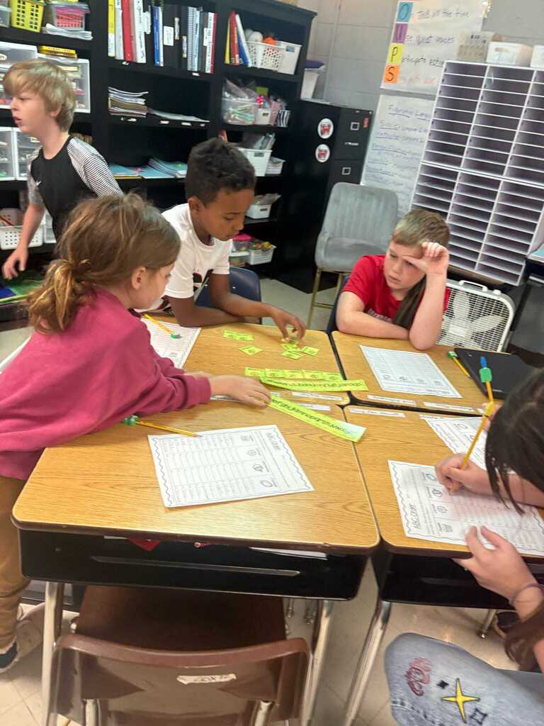 Ms. Shannon Cox’s fourth graders are working in station groups to review previously taught skills, including alphabetical order and category word sorts.  Students are collaborating with their classmates and taking ownership of their learning by checking their own work with an answer key. What a great way to build both skills and independence! ❤️🤍