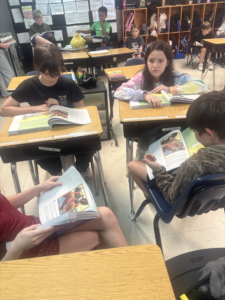 Mrs. Shannon Cox’s fourth-grade students are putting their reading skills to work through literature groups! Each student takes on a specific role—leader, timekeeper, investigator, or reporter—as they work together to reread a text and answer both explicit and inferential questions using evidence from their reading. Along the way, they’re strengthening reading comprehension, communication, and teamwork skills! Warriors putting learning into action! ❤️🤍