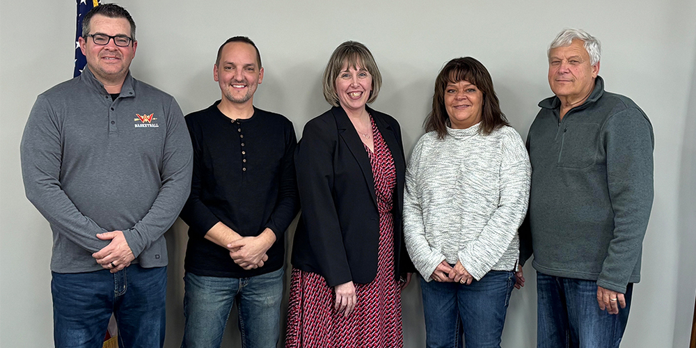 Pictured above, left to right, is board member Tobey Schwartz; board member Chad Bender; new Topeka Elementary School principal Shannon Chavis; board member Carrie Schrock; and board member Keith Lambright.