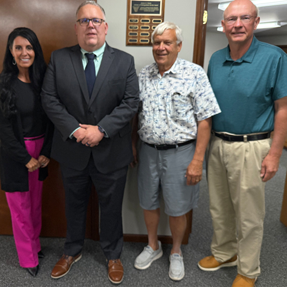 Pictured here from left to right are Superintendent Dr. Jaime Carroll, Dean of Students Bret Bajdek, School Board President Keith Lambright, and School Board Member Chuck Christner.