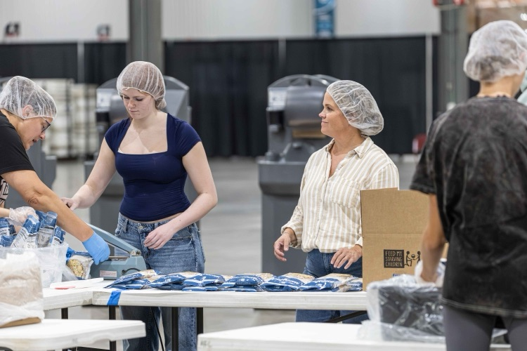 Cora Owens and Jesse Martin at Feed My Starving Children 2025