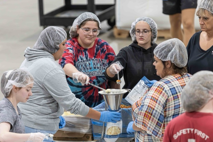Liliana Terrones and Kylie Singleton at Feed My Starving Children 2025