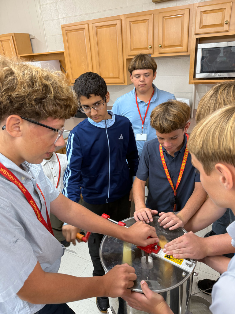 Students processing honey