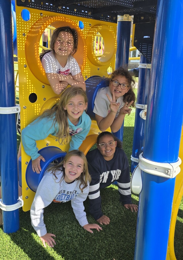 Girls in the playground tubes. 