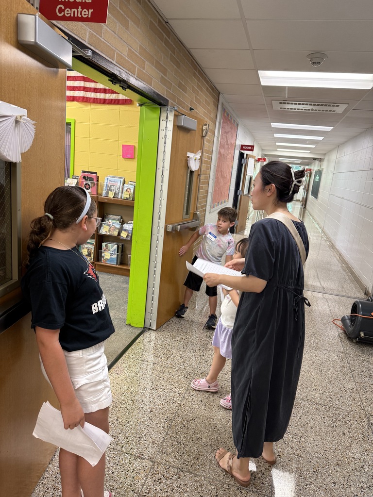 photo of students and parents walking in hallway