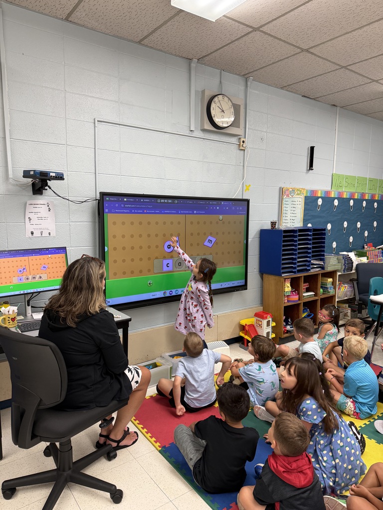 K students on rug