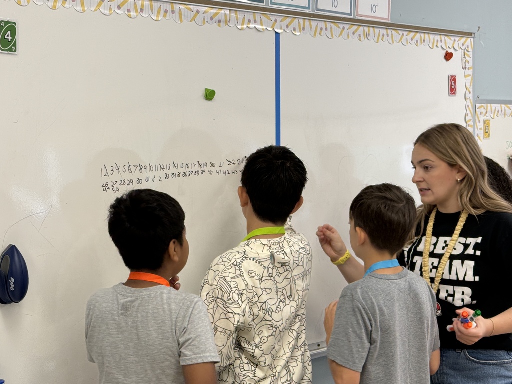 students with numbers on the board
