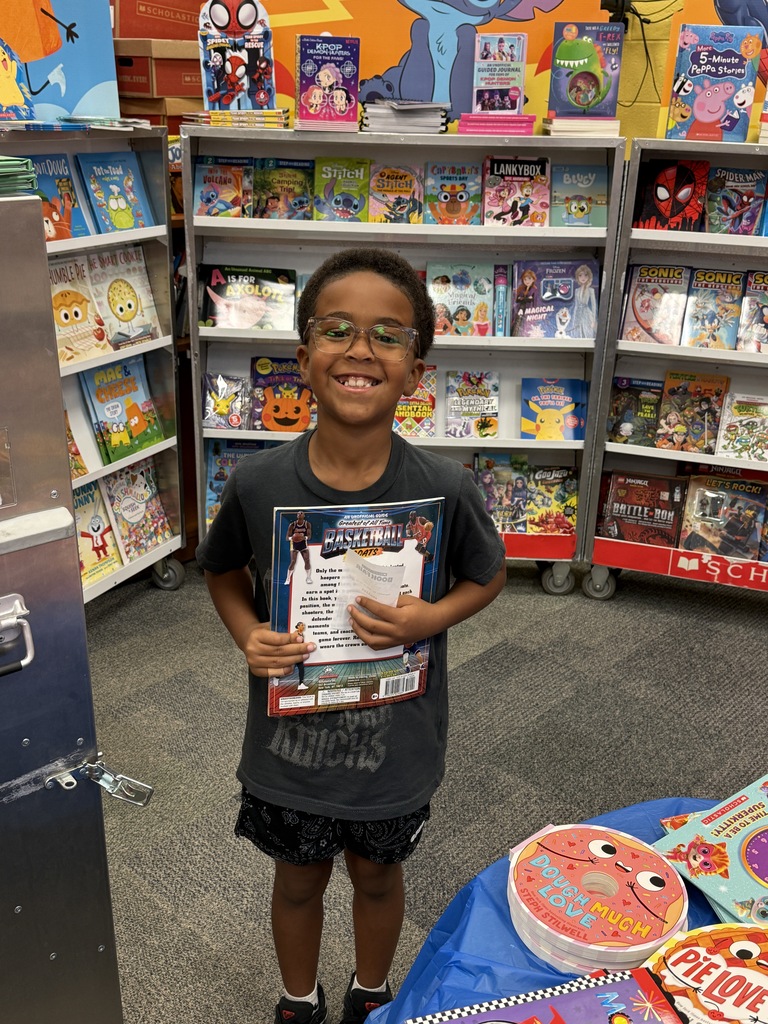 student holding book