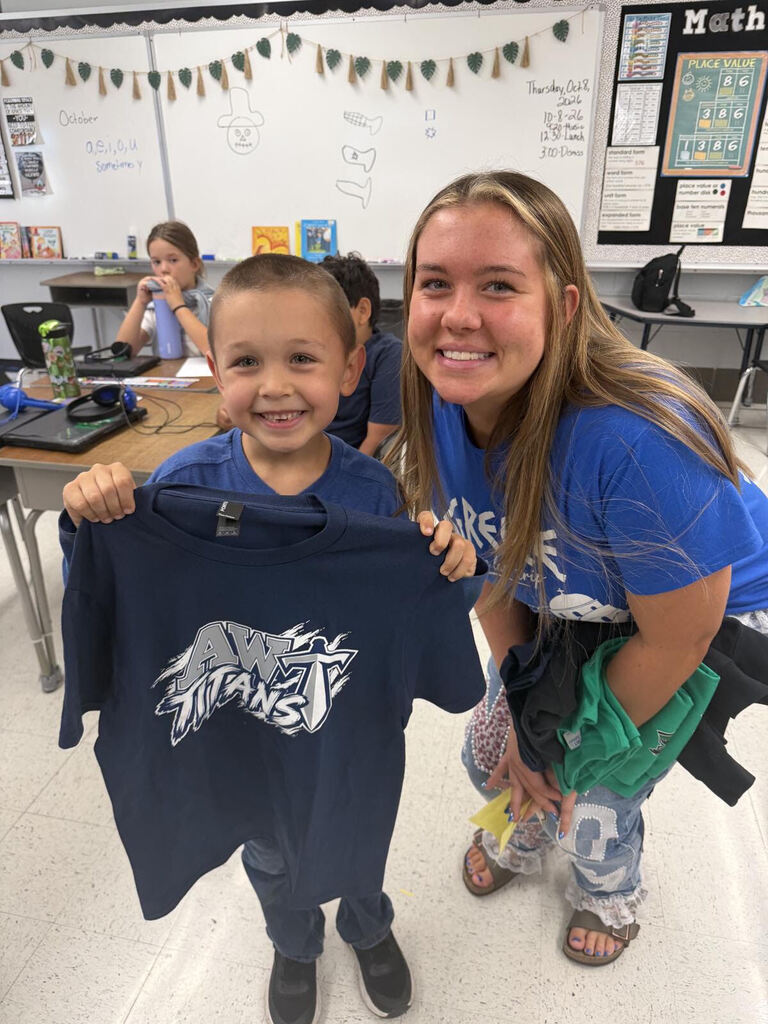 Maddie Verscha delivering spirit wear to elementary students