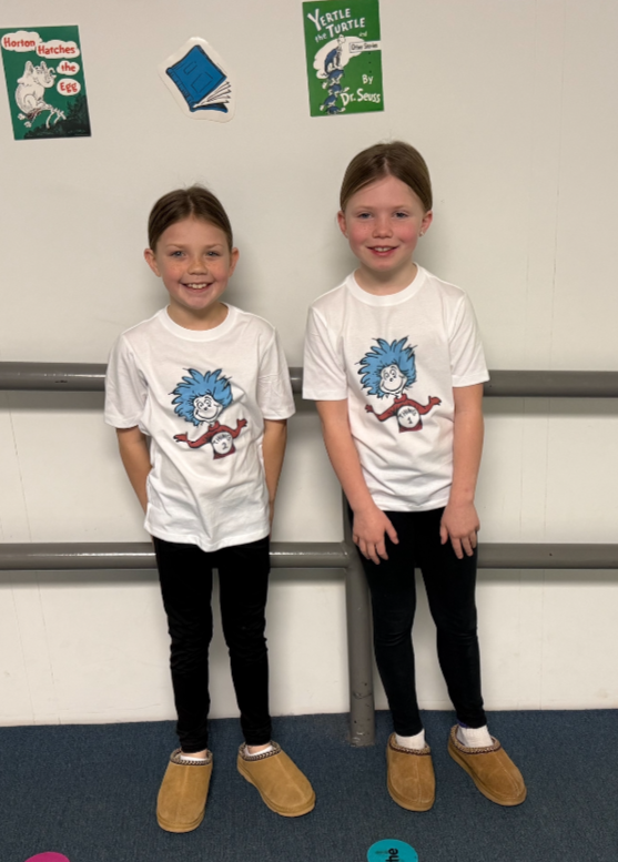 Students posing with their twin for Thing One and Thing Two day. 