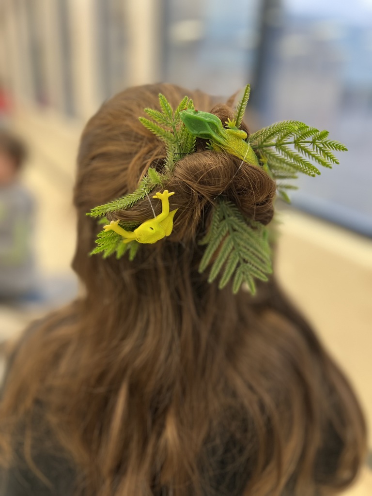 A student had a frog and leaves in her hair for crazy hair day. 