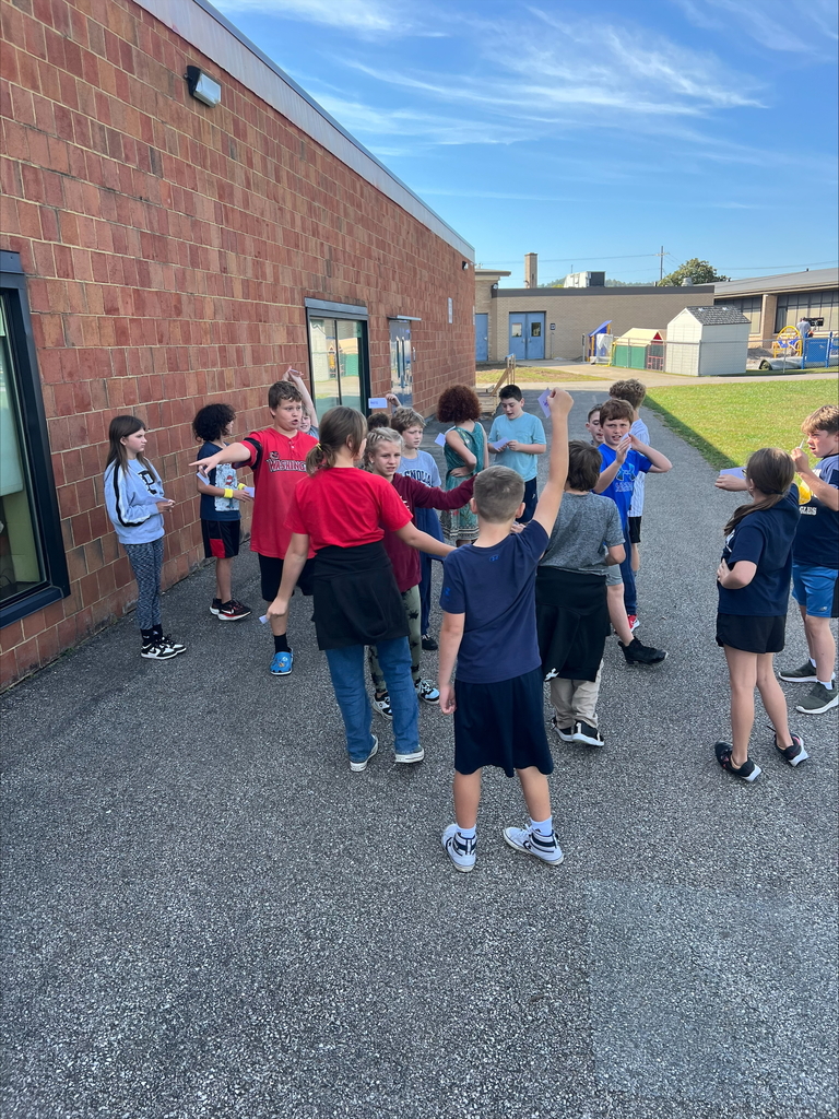 Students lining up along with Miss Long as a the decimal point. 