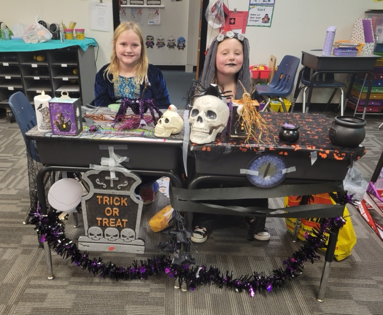 Students showing off their desk decorations. 