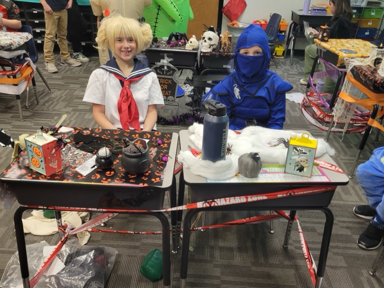 Students showing off their desk decorations. 
