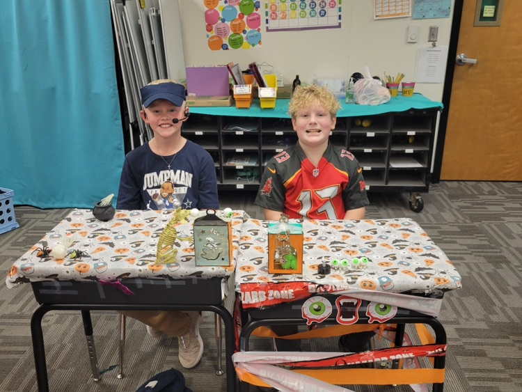 Students showing off their desk decorations. 