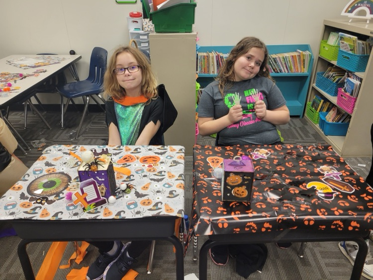 Students showing off their desk decorations. 