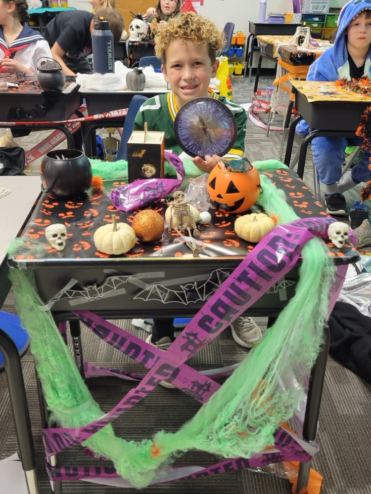 Student showing off their desk decorations. 