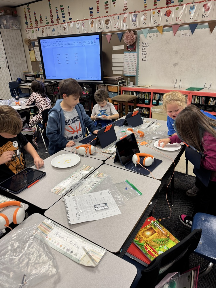 group of students around desks 