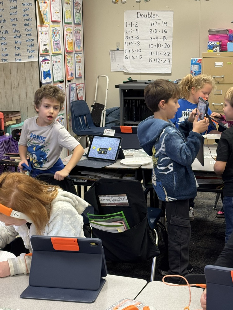 students standing at there desks 