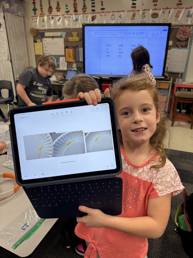 female student holding her laptop 