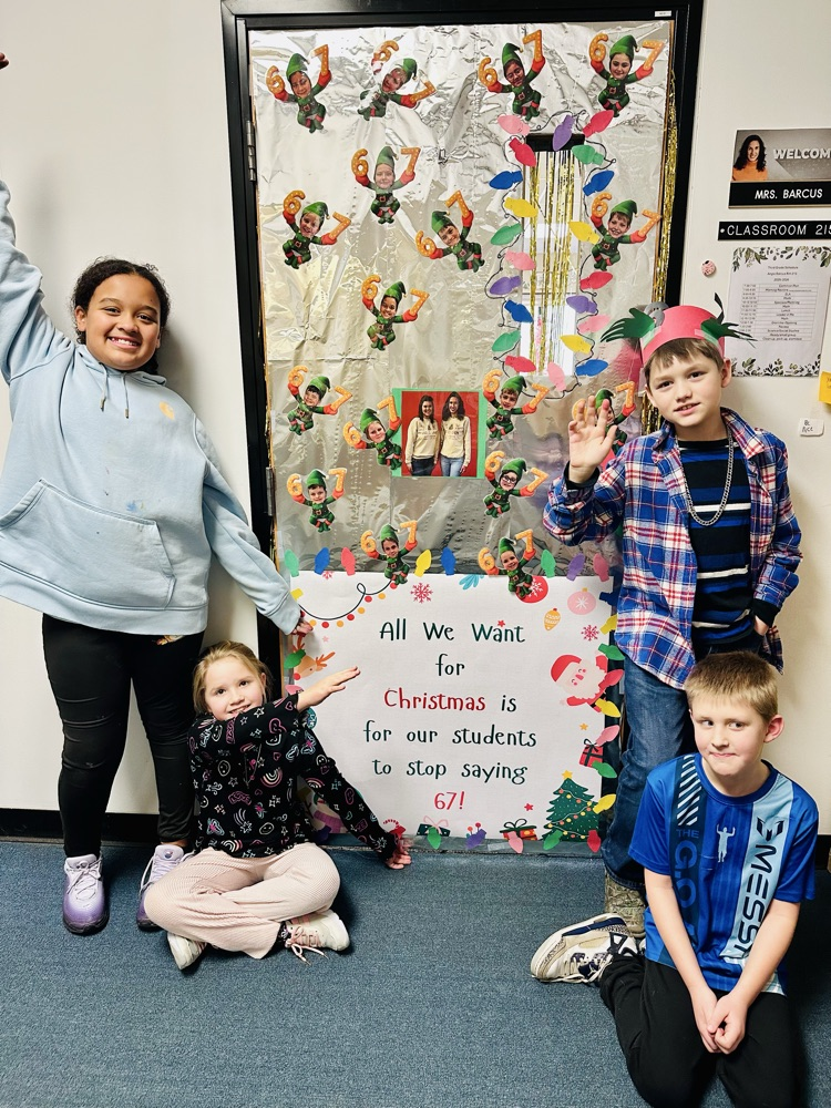 students sitting at their classroom door 