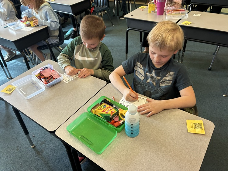 two students at desks 