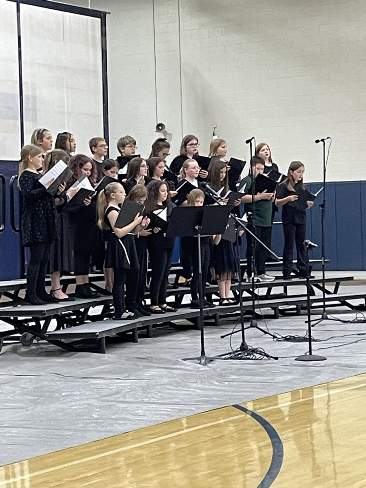 students in black in the risers