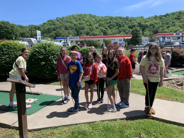 students at a put put hole 