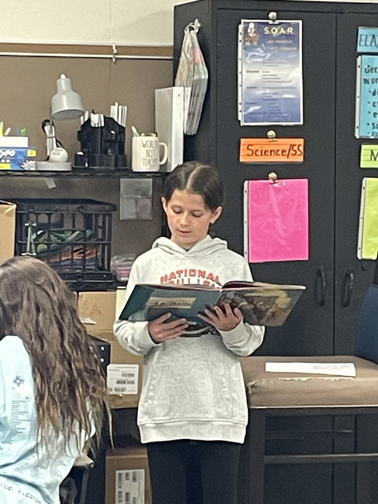 Laura Mason reading to the first grade students. 