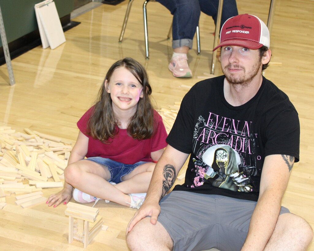 Smiling man and girl