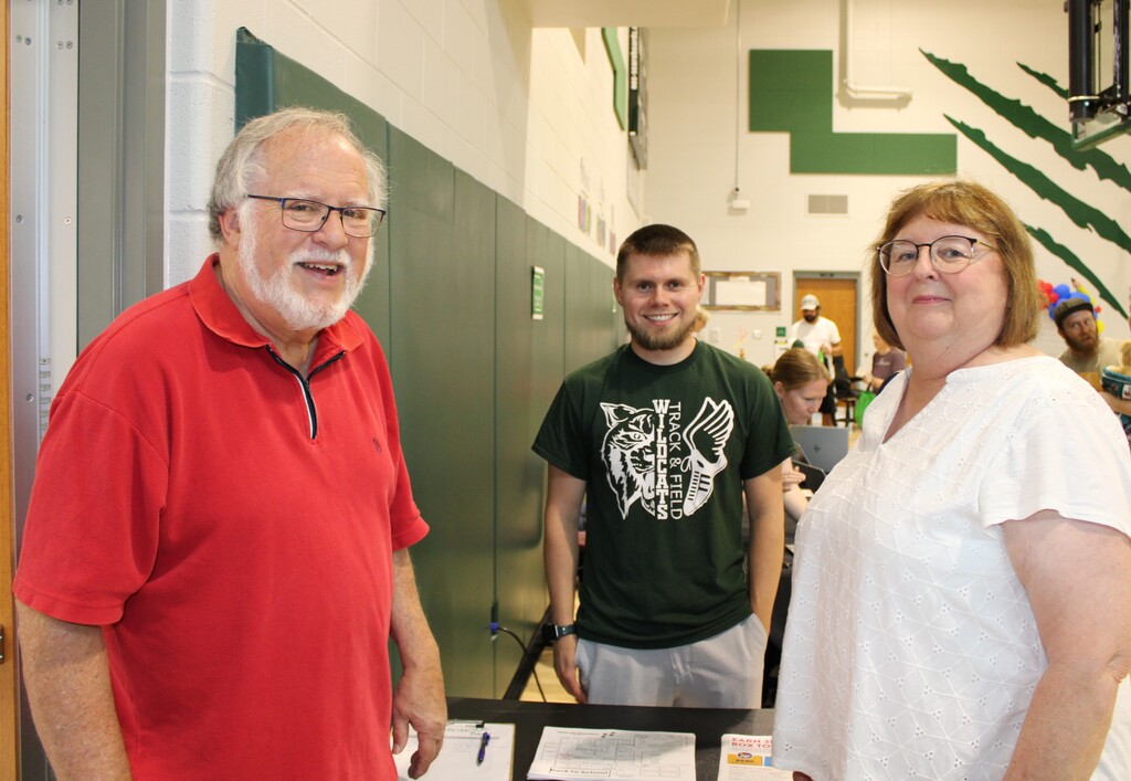 Smiling woman and two men