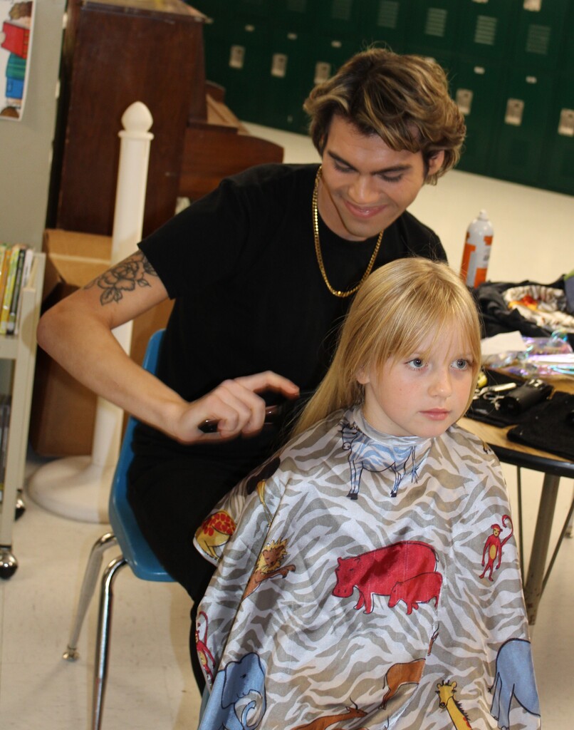 Girl getting hair cut