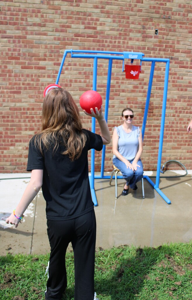 Student tossing ball