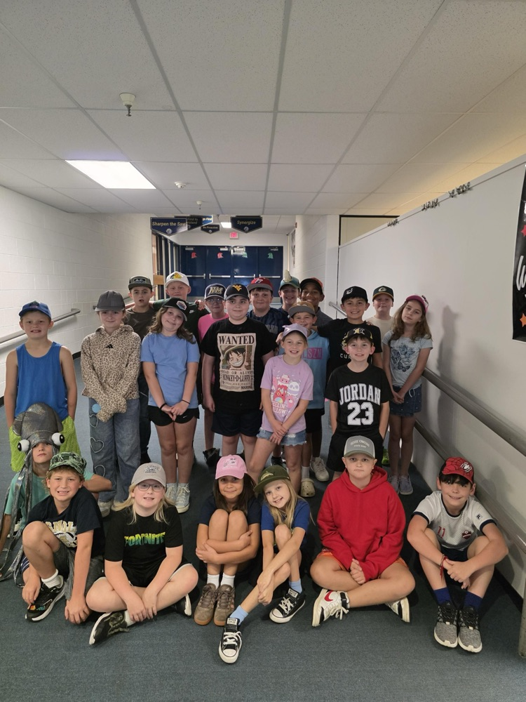 4th graders in the hall wearing their hats to support  a cancer community member 