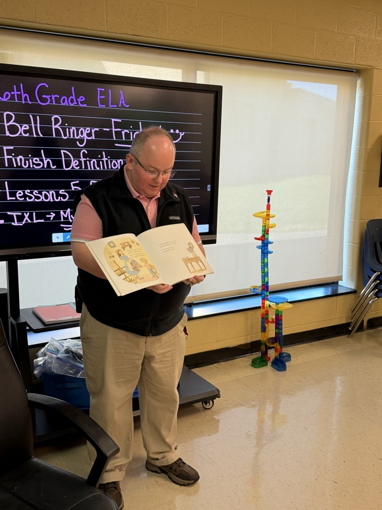 Mr bell reading a book 