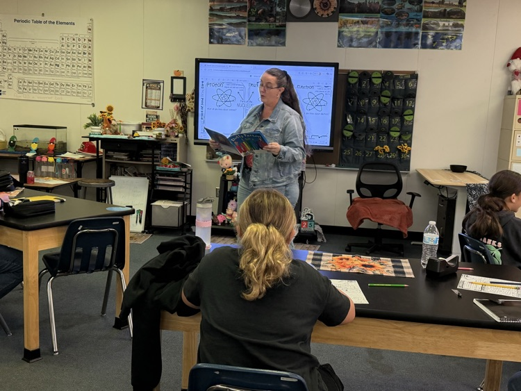 landis reading a book to her class